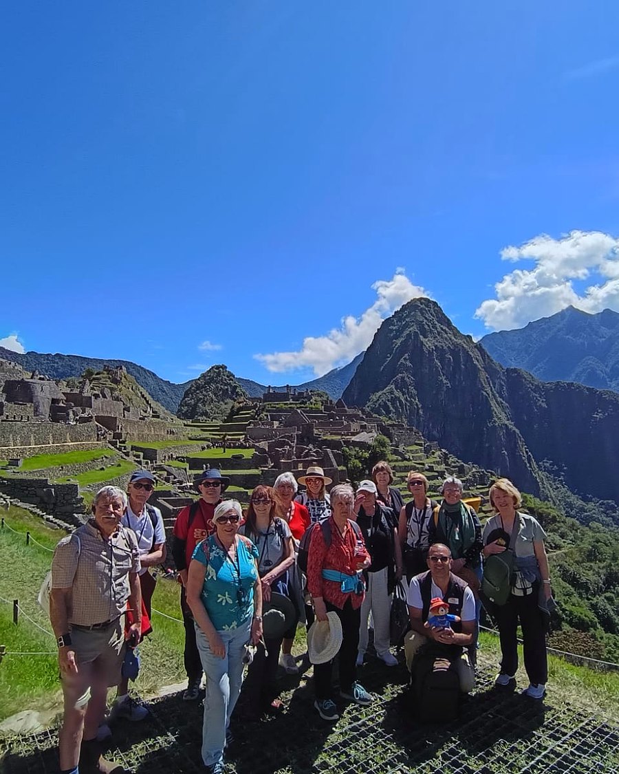 Francisco with travelers at Machu Picchu