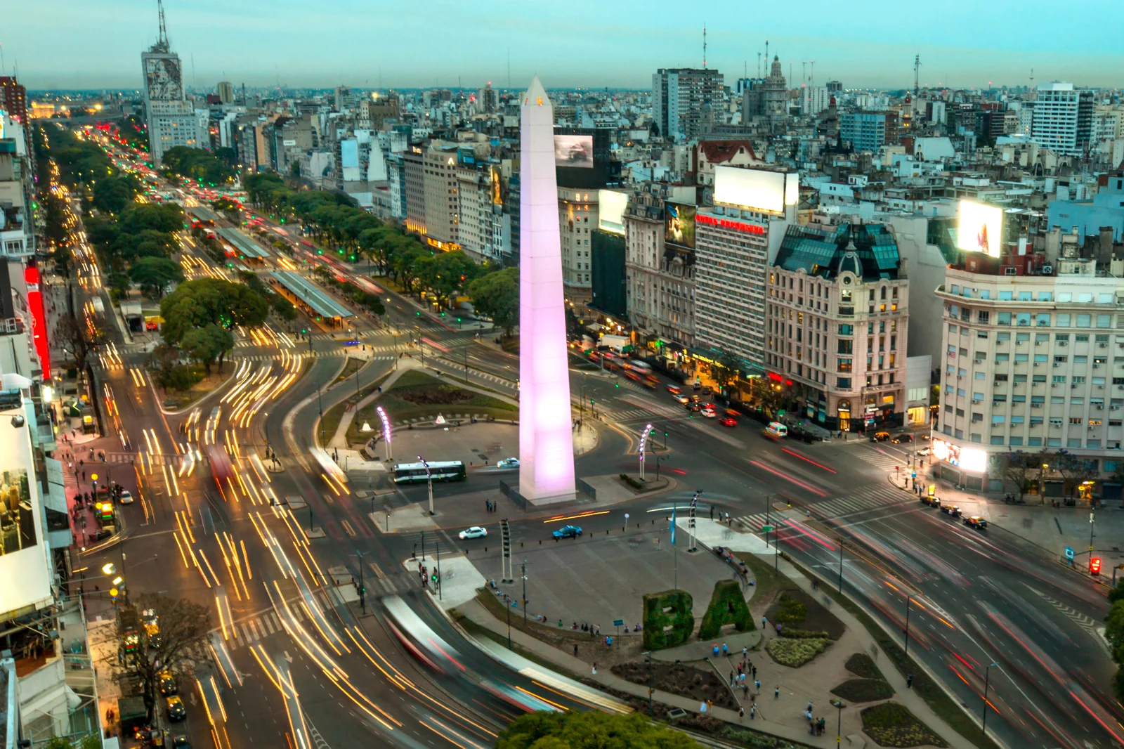 Elevated view of the Obelisco and Avenida 9 de Julio at dusk.
