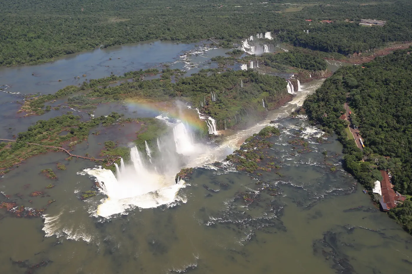 Iguazú Falls, a wide horseshoe of white water in the rainforest on the Argentina–Brazil border.