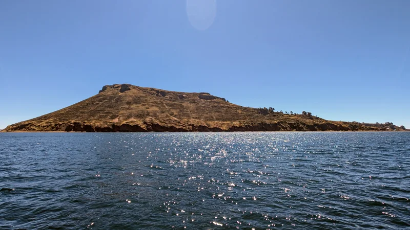 Amantaní island above the deep blue water of Lake Titicaca.